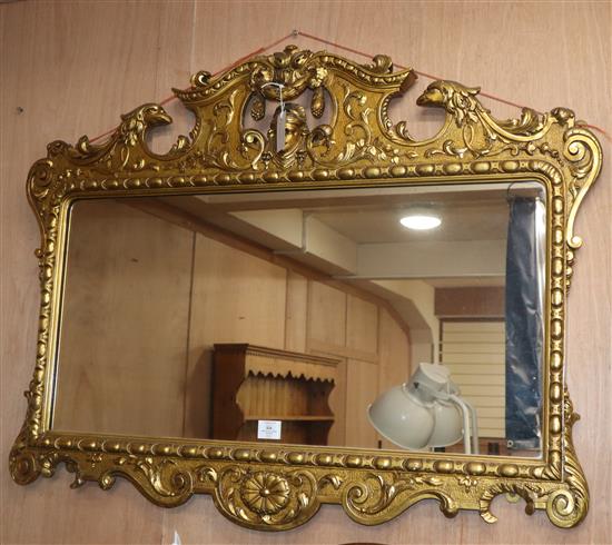 An ornate gilt wall mirror W.108cm